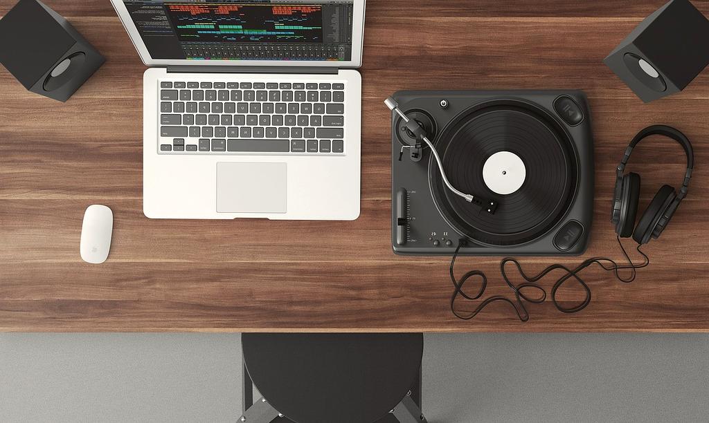 Workspace with laptop showing blog article and notes