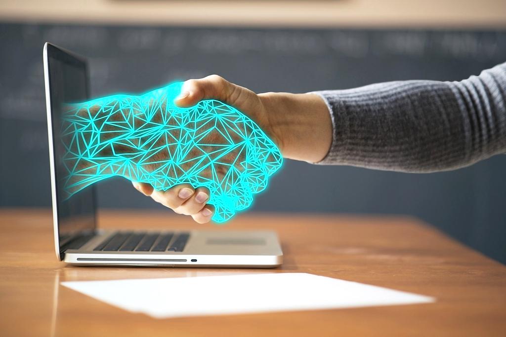 Holographic interface displaying real-time collaboration between team members across multiple devices